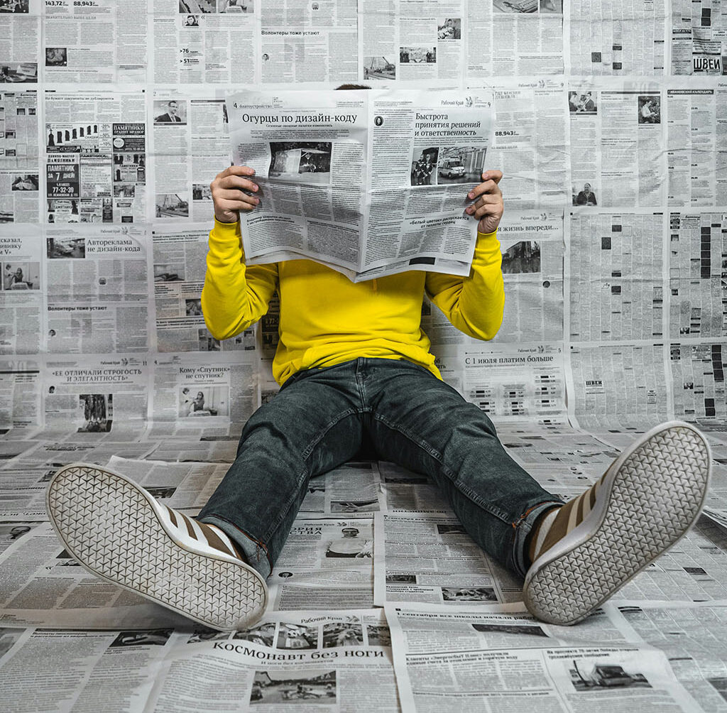 A person reading Newspaper